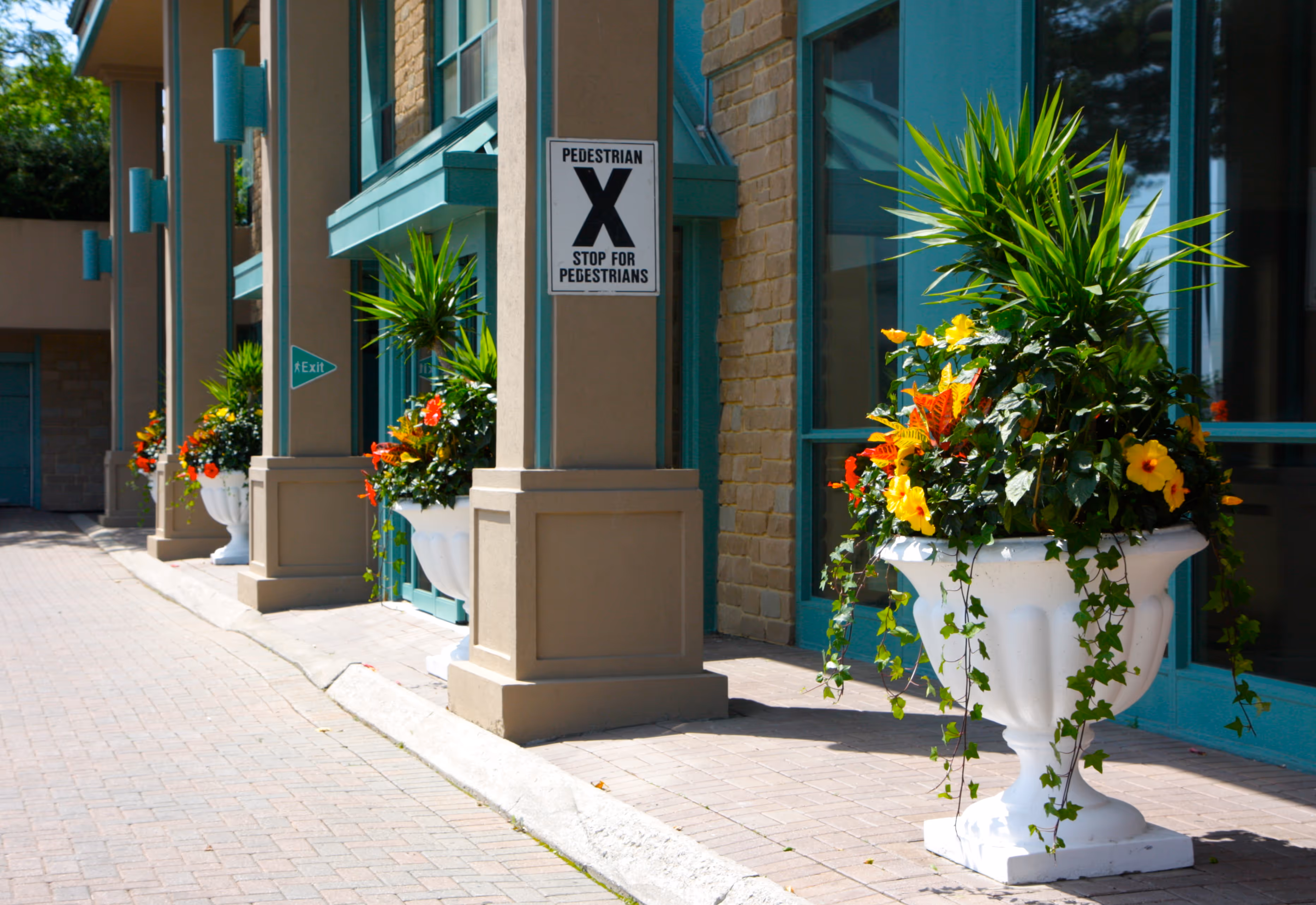Commercial front entrance planters by Landcare